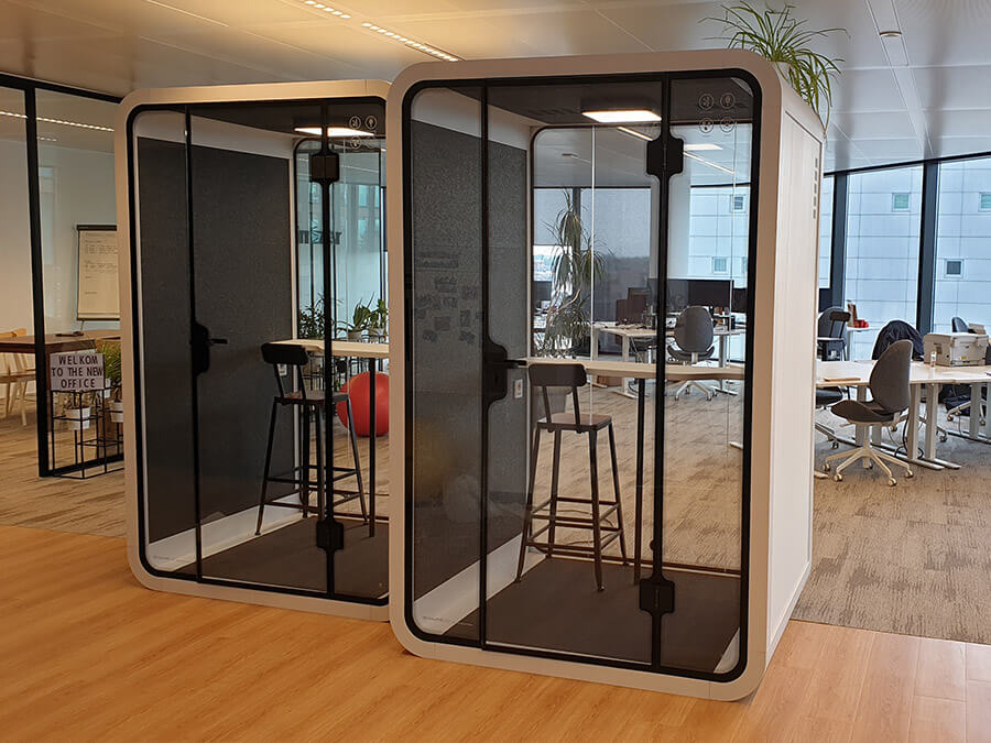 Medium white private office pod is placed in open office